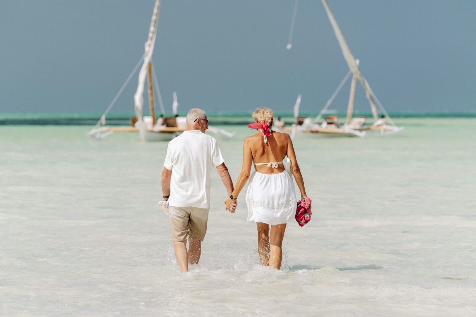 Couple walking the beach on holiday