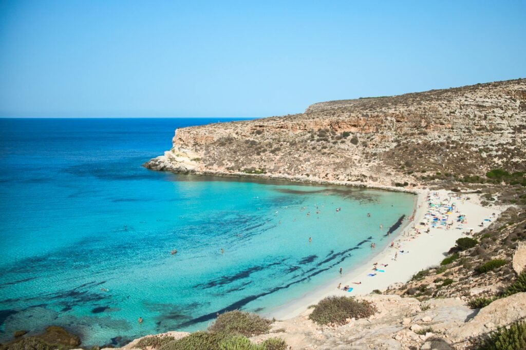 Discover the tranquil beauty of Rabbit Beach in Sicily with its stunning turquoise waters and sandy coastline.